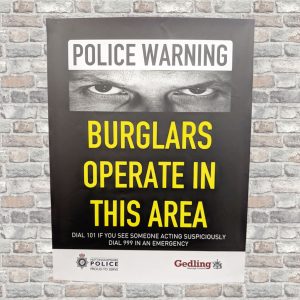 Yellow & black poster with signs with eyes design used to deter burglars