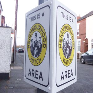 tri-ad sign attached to lamppost advising neighbourhood watch area