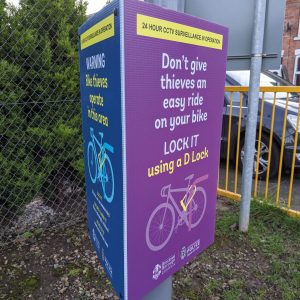 tri-ad sign attached to lamppost advising bike users to lock their bikes